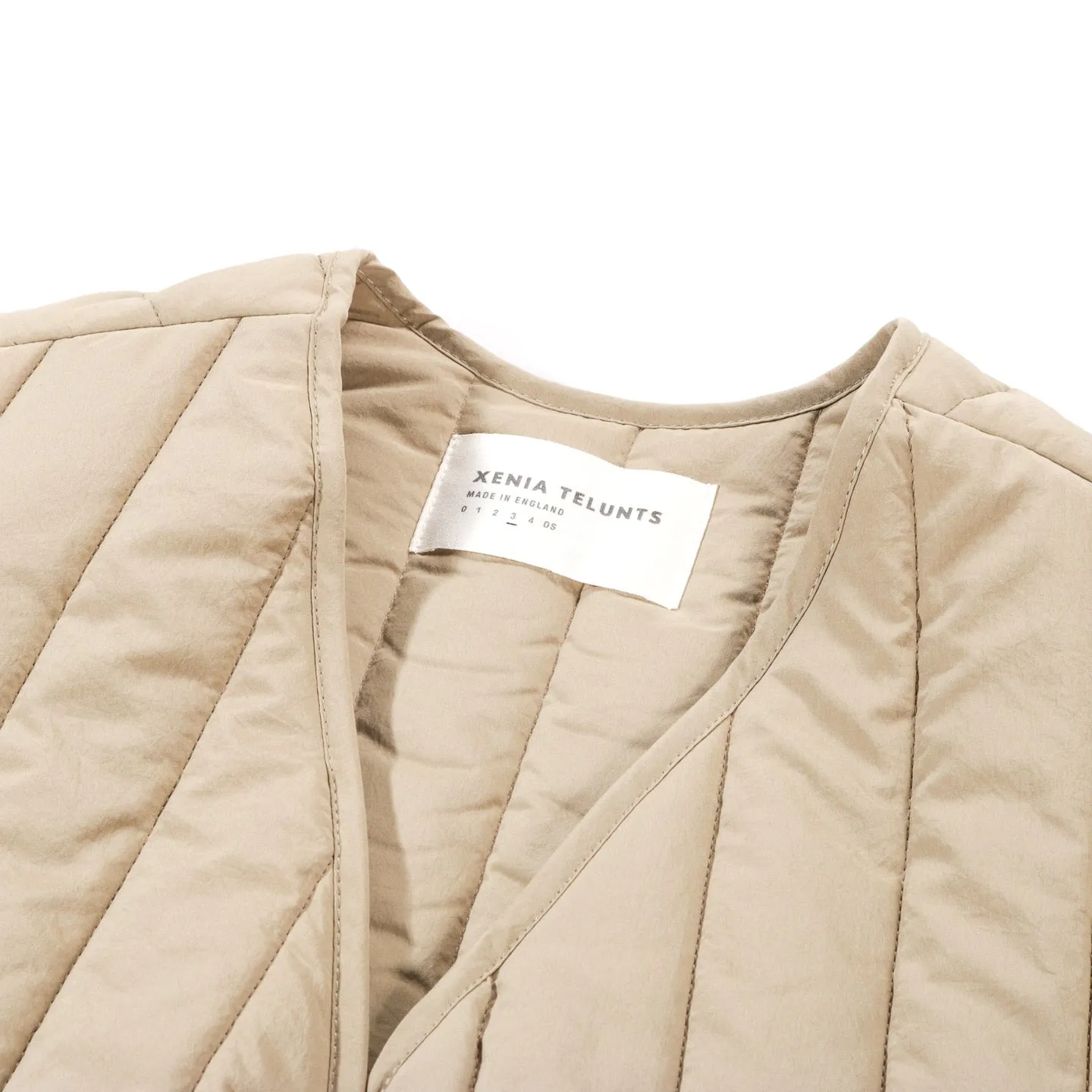 XENIA TELUNTS QUILTED GILET BEIGE